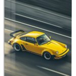 Yellow Vintage Sports Car in Motion metal wall art print
